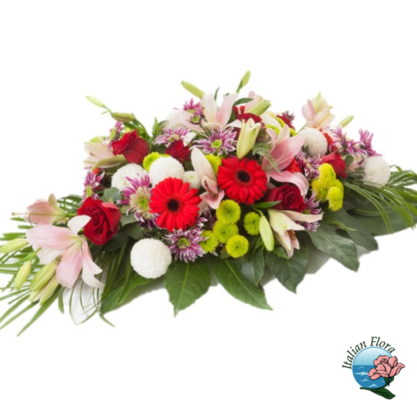Funeral spray with pink, purple and red flowers