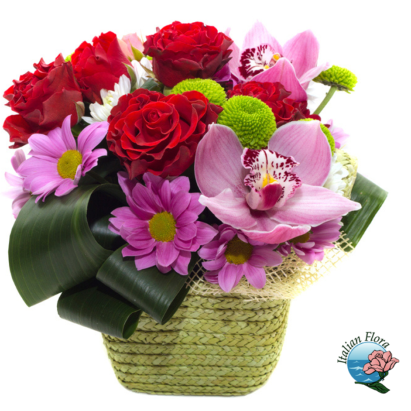 Basket of red roses and purple flowers