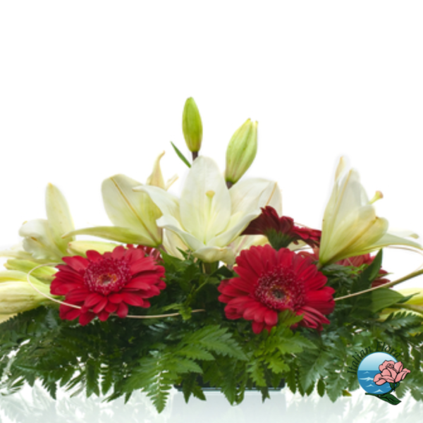 Arreglo funerario de gerberas rojas y azucenas blancas